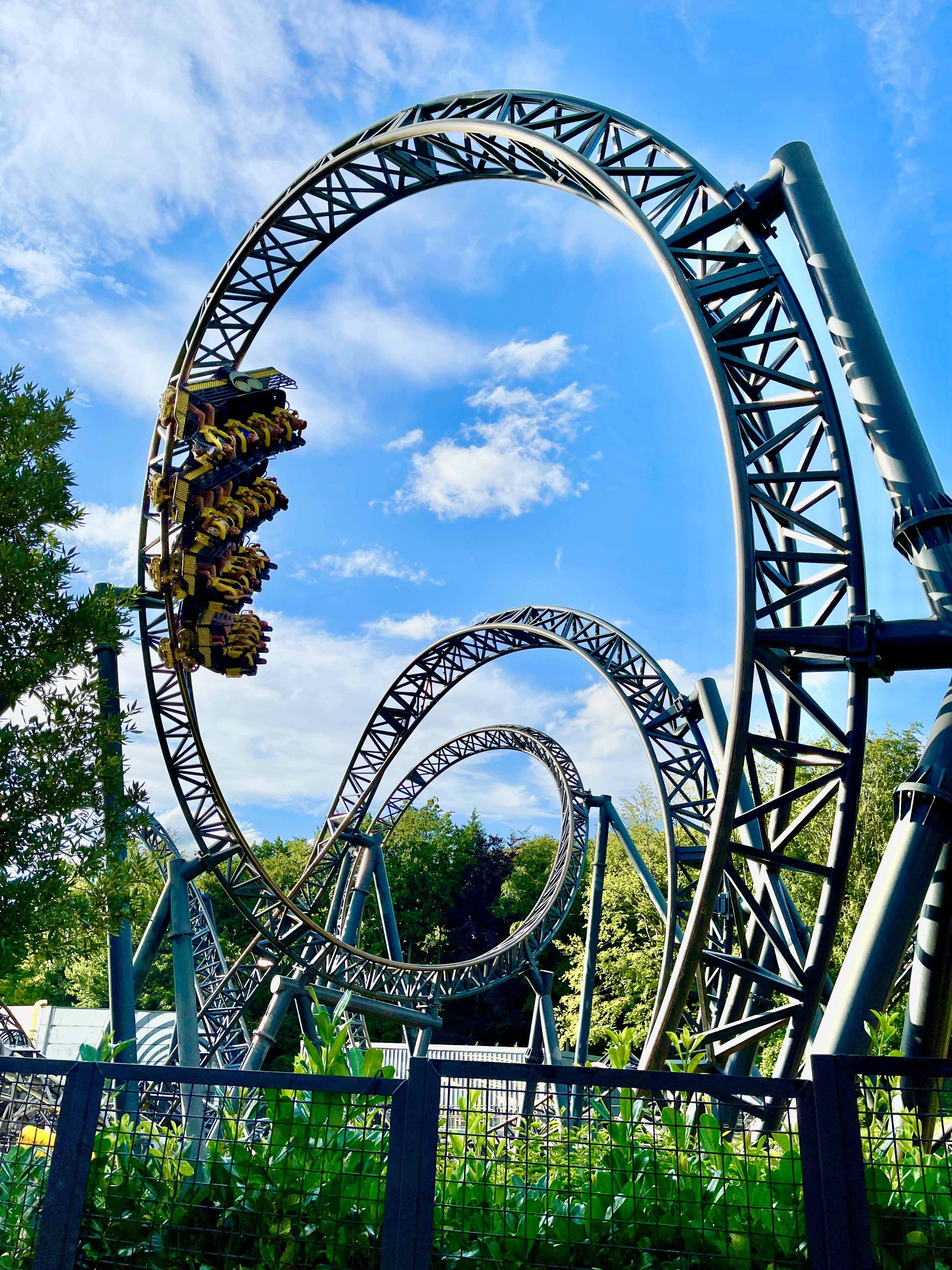 green and brown roller coaster under blue sky during daytime